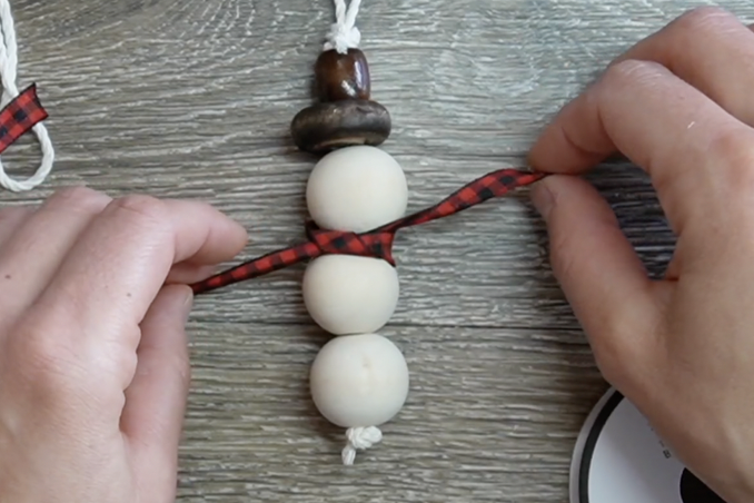 cut a piece of ribbon tie between top two beads for scarf